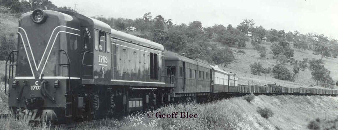 C1703 near Swanview on the eastern main line with an unusal consist which includes the ex steamrail car which has been converted to a Track Inspection Car